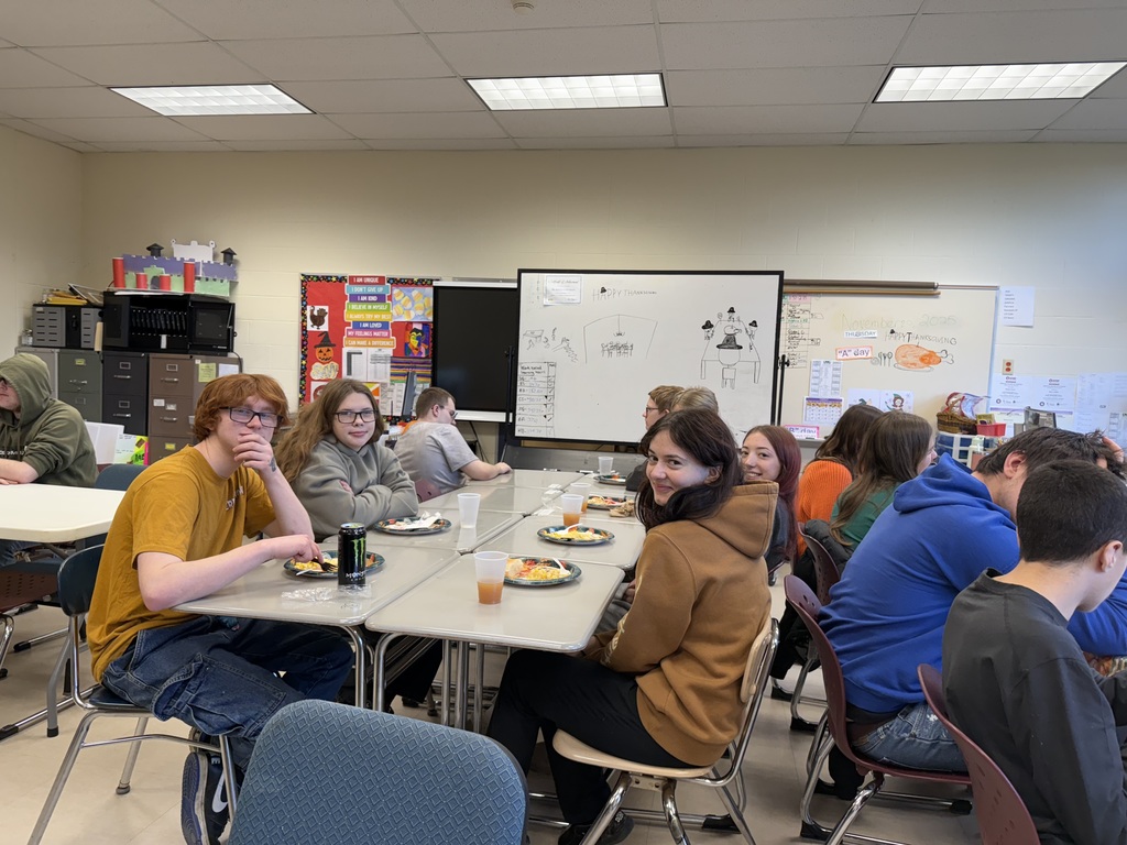 Students gathered in a room for the College and Careers for Every Student/Brilliant Pathways kickoff event sharing a meal with mentors and mentees