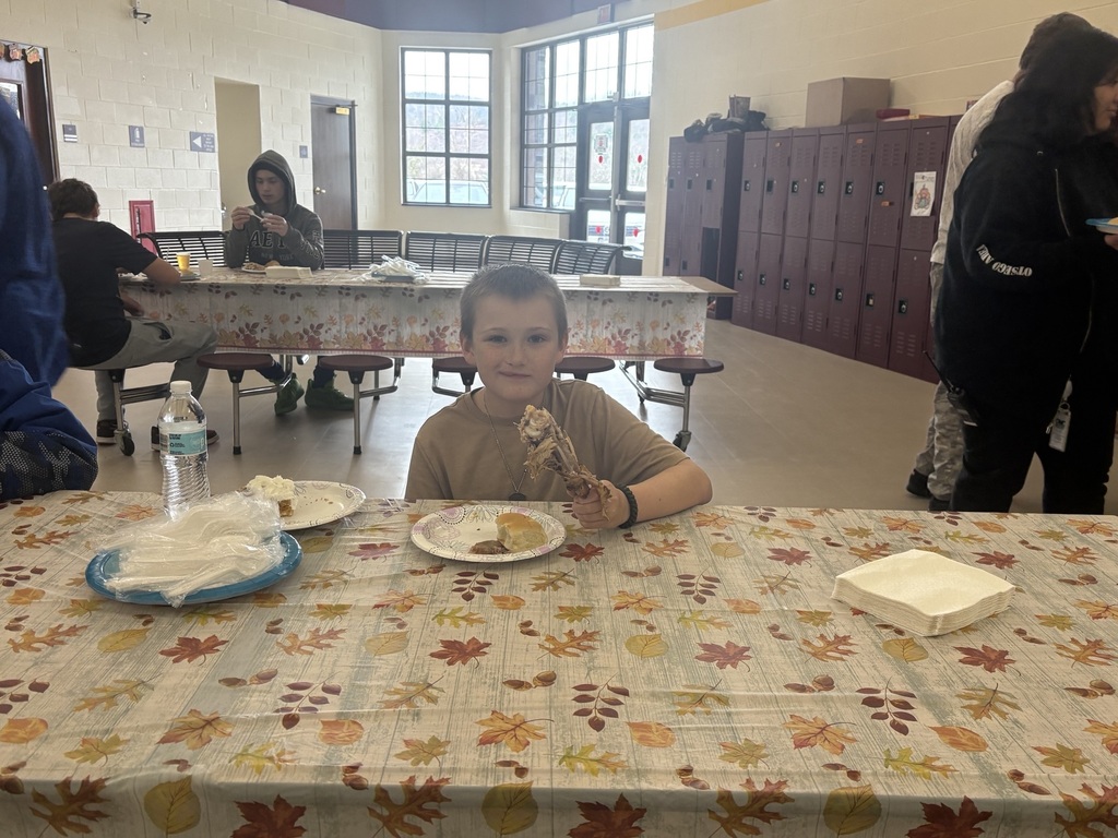 Students enjoying thanksgiving turkey for lunch