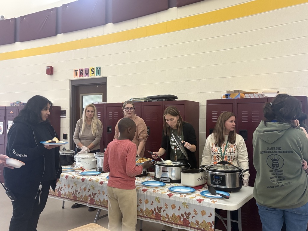 Staff serving thanksgiving lunch to students