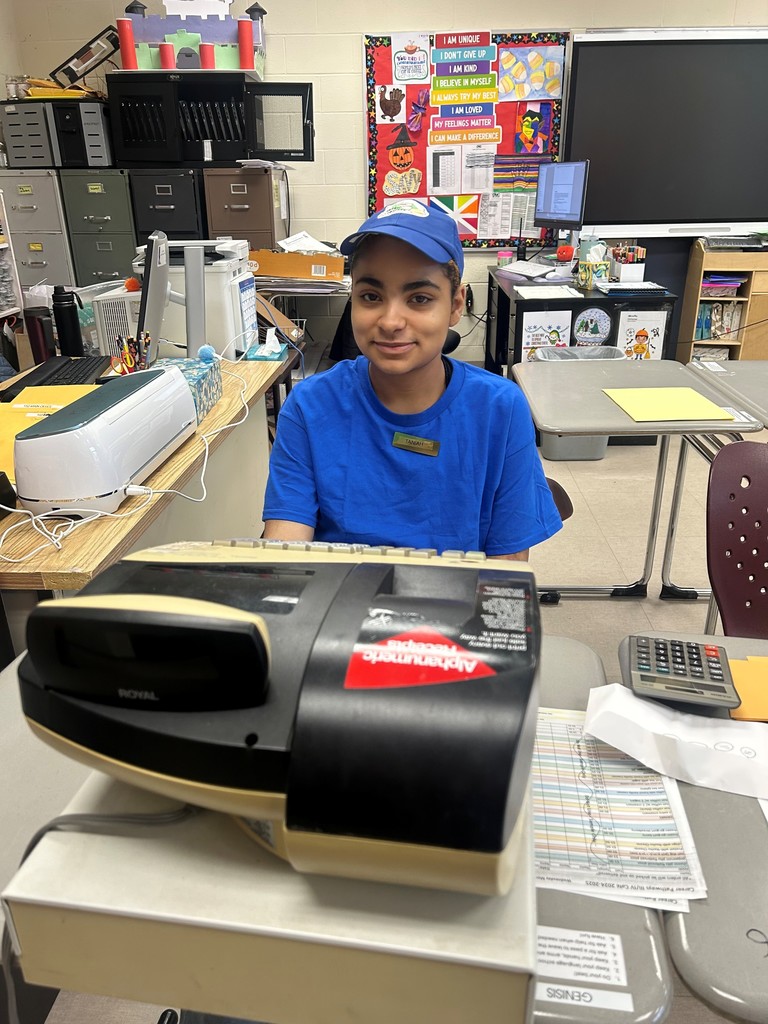 Student working in school cafe with cash register