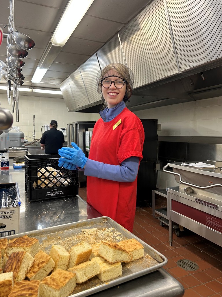 Student working in a kitchen with biscuits