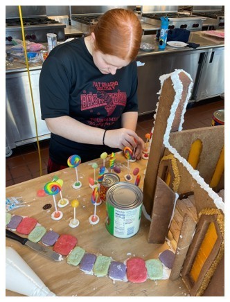 Student decorating gingerbread