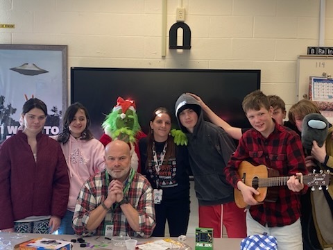 The Grinch with a teacher, staff member, and 4 students