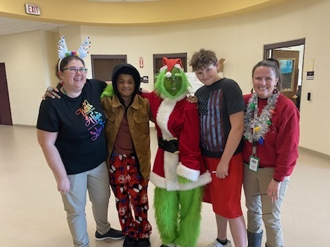 The Grinch with two staff members and two students