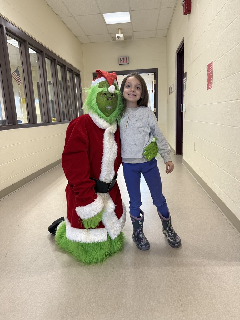 The Grinch with an elementary student