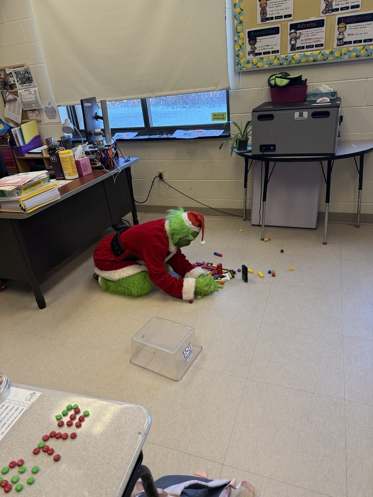 The Grinch playing with blocks