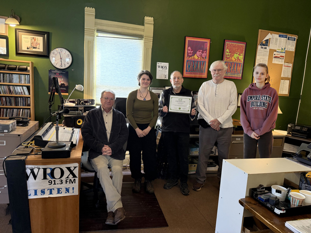 Two students and three WIOX employees in a radio studio