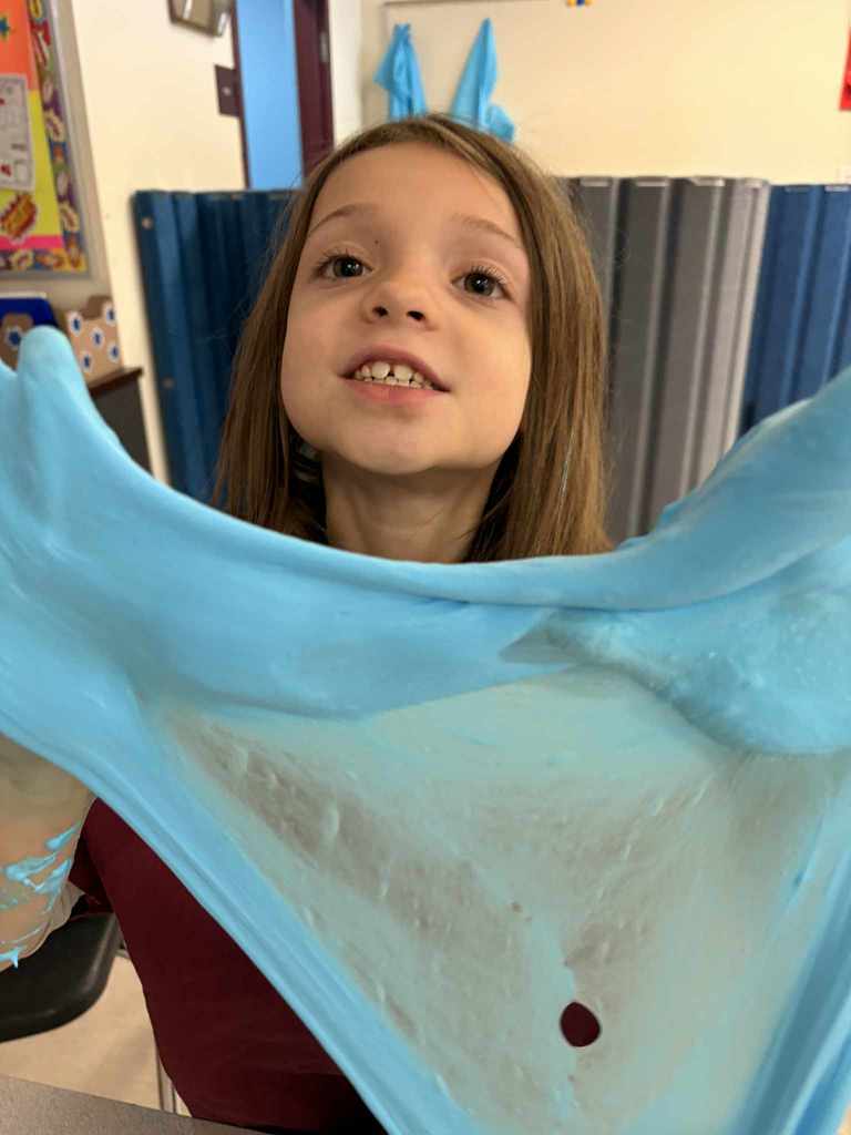 Student playing with fluffy slime