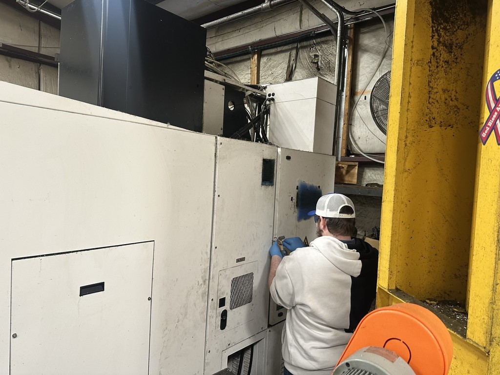 Student working on machinery