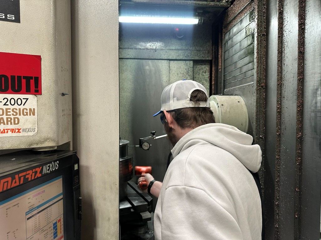 Student working on machinery