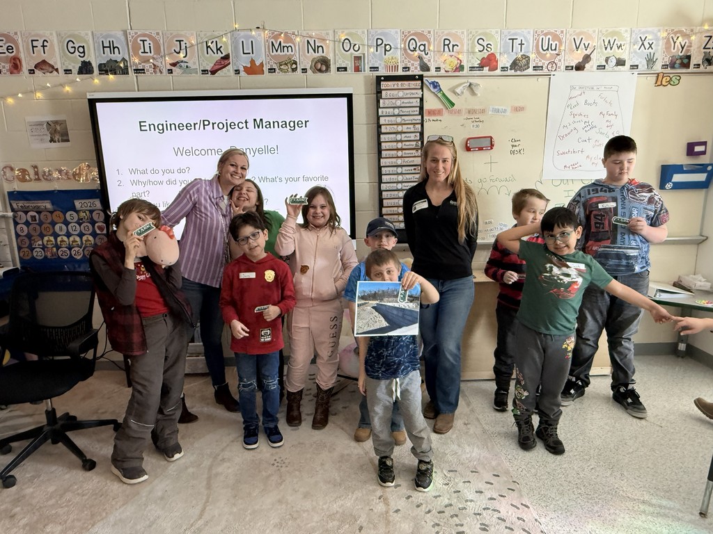 Group of elementary students and teacher with guest speaker, Danyelle, Engineer/Project Manager