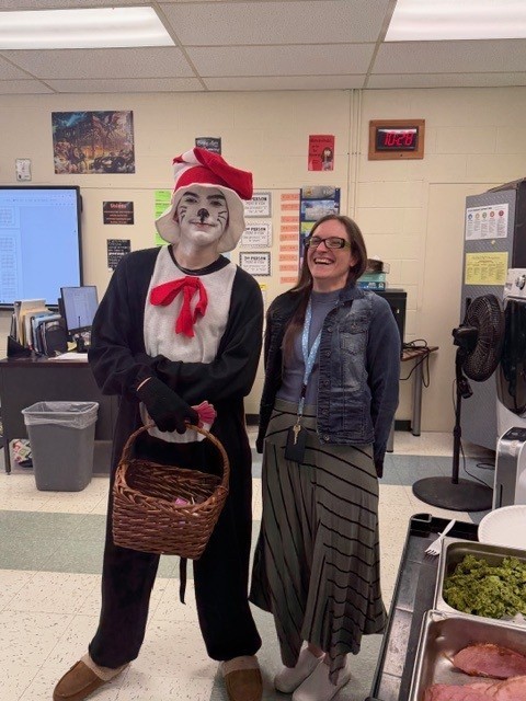 High school student, Cole, dressed as The Cat in the Hat with a teacher