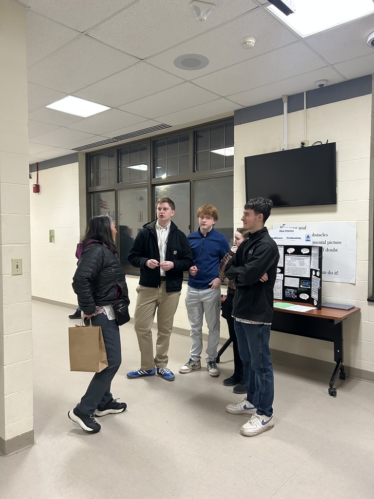 Students and adult in the hallway