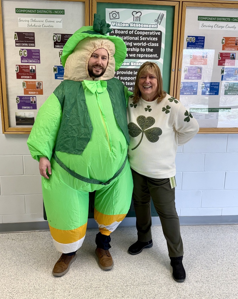 Principal dressed in leprechaun suit with assistant principal