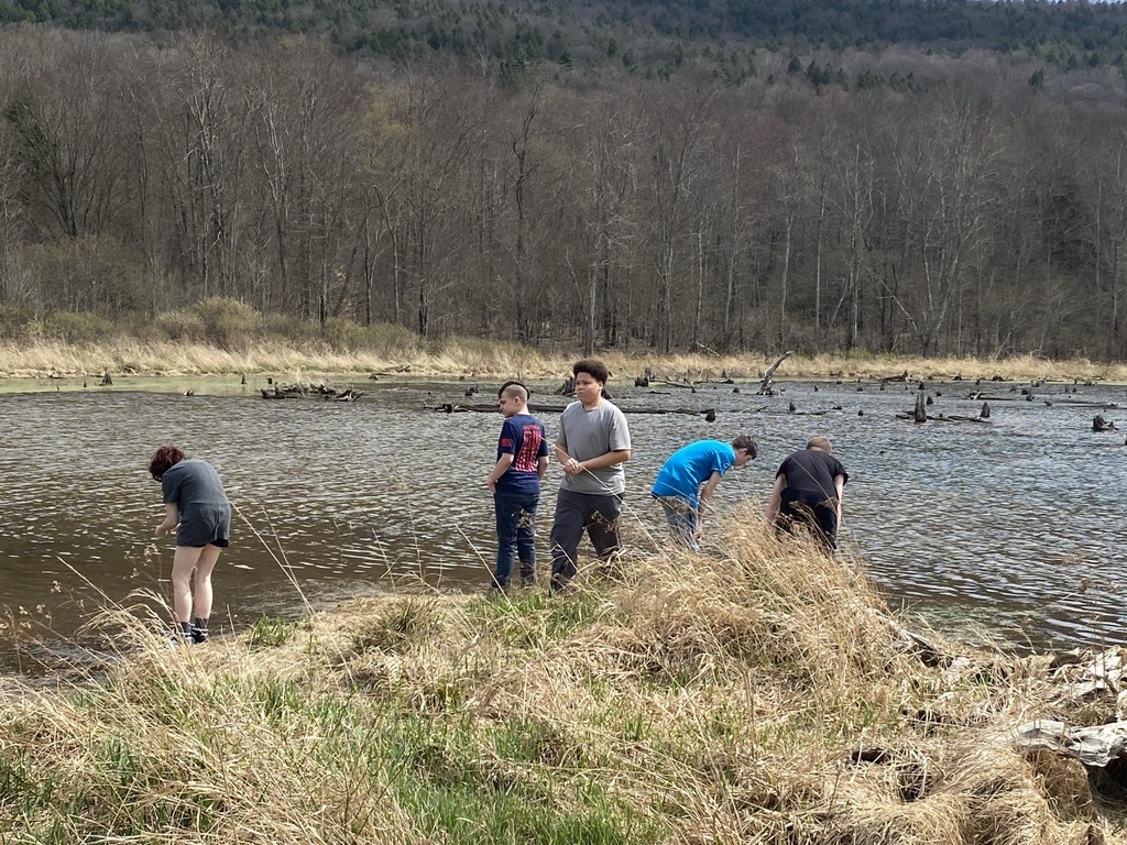 Five students by a pond