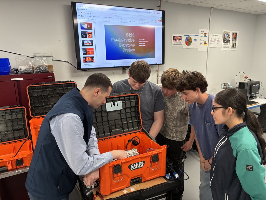 Engineering students working on their project