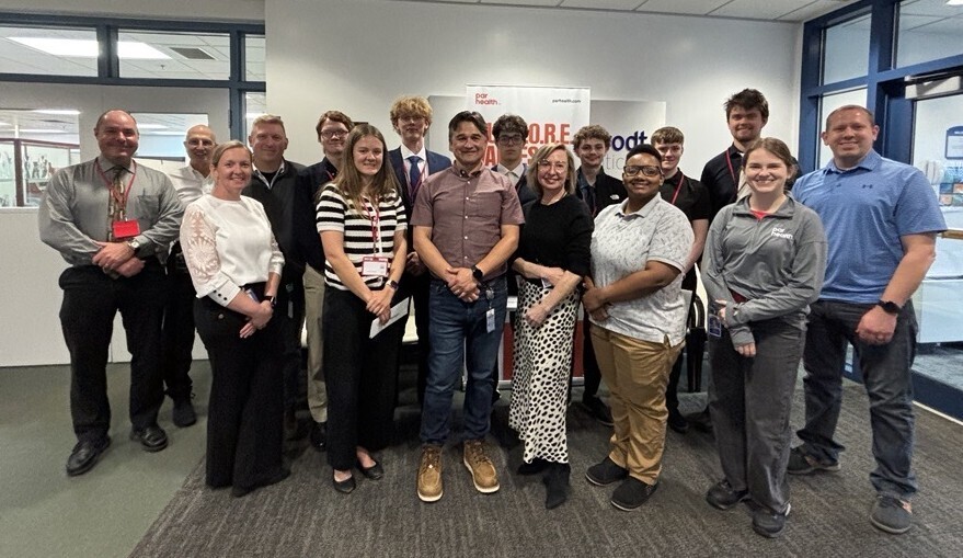New Visions Engineering students and instructor pose with employees of Par Health