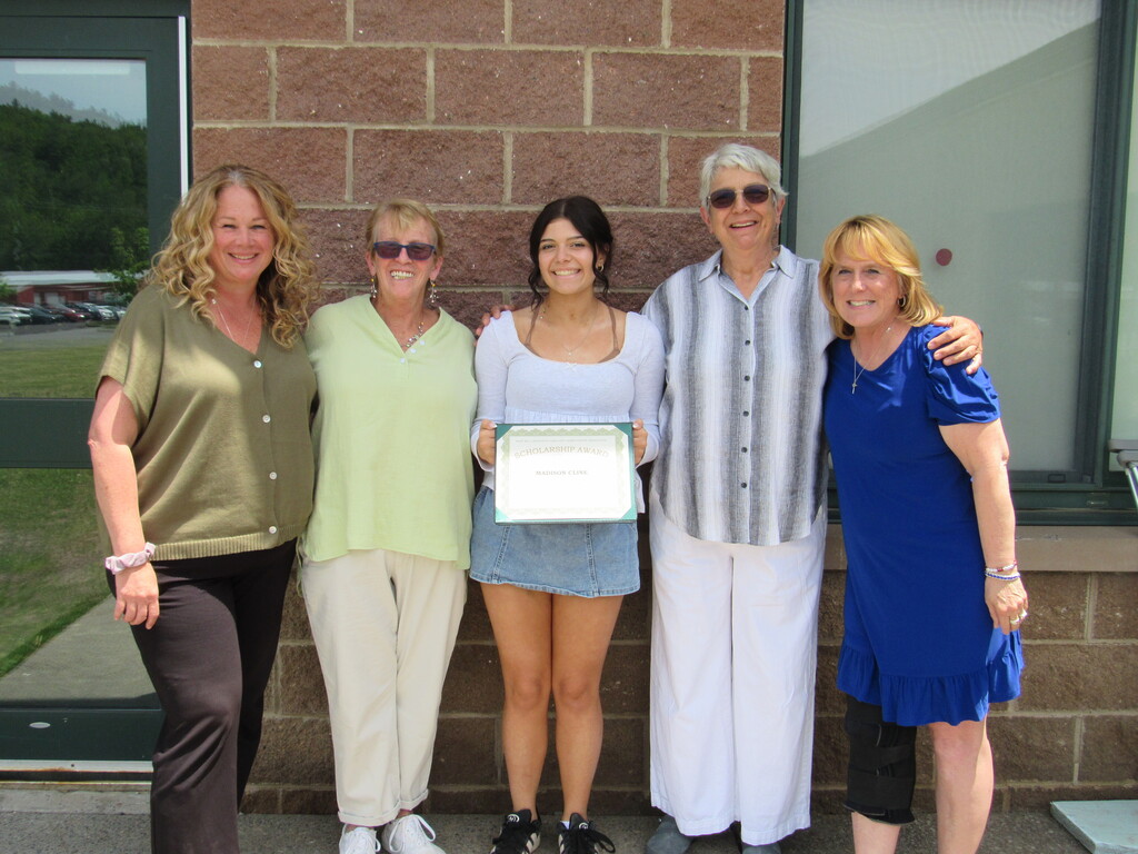 CTE instructor, two members of the west kill community center, student, and NCOC building counselor posing for a picture with the student holding a certificate.