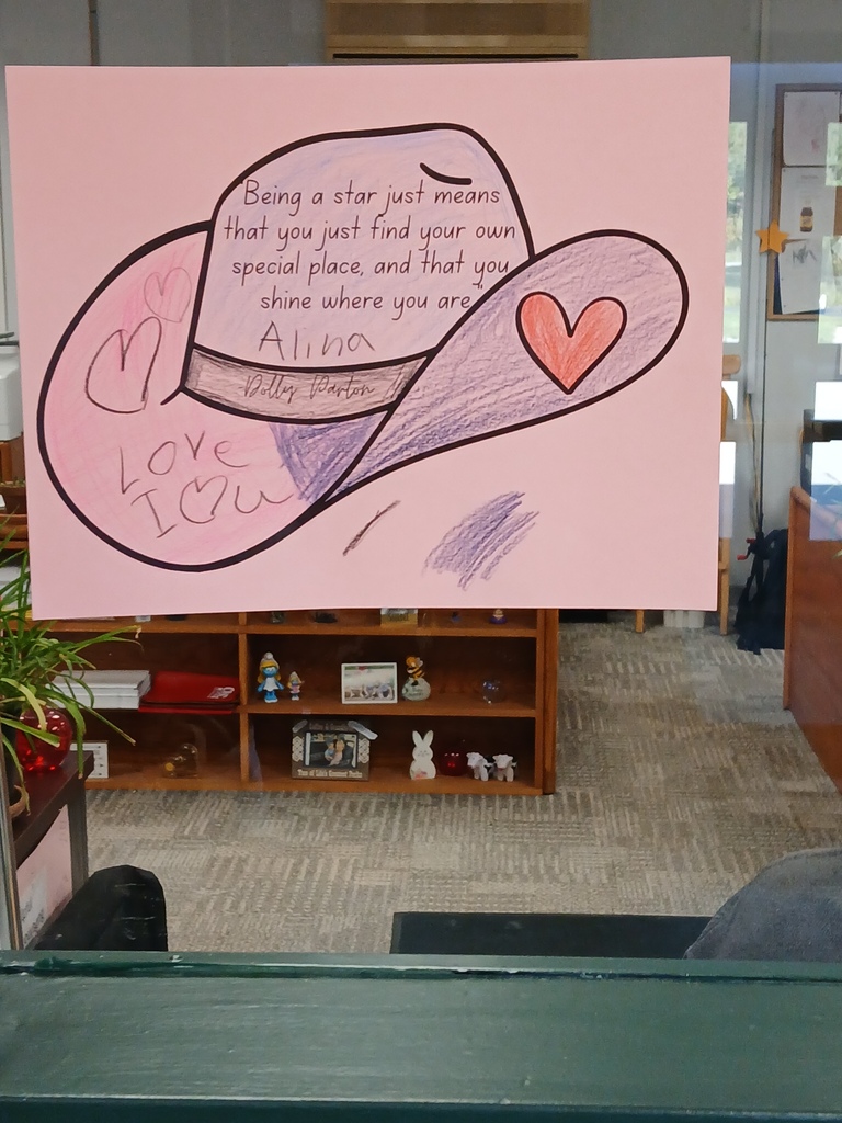 A picture of a cowboy hat on pink paper that a student colored that says being a staf just means you just find your own special place and that you shine where you are. The student wrote "Love" and I heart u