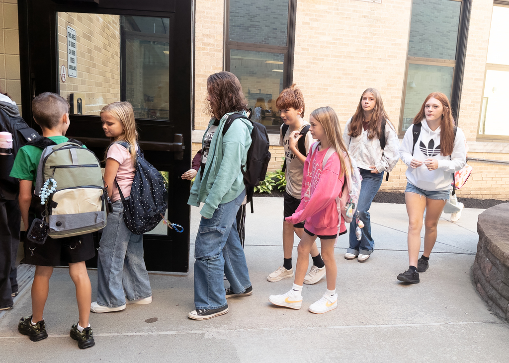 Students waiting to get into school