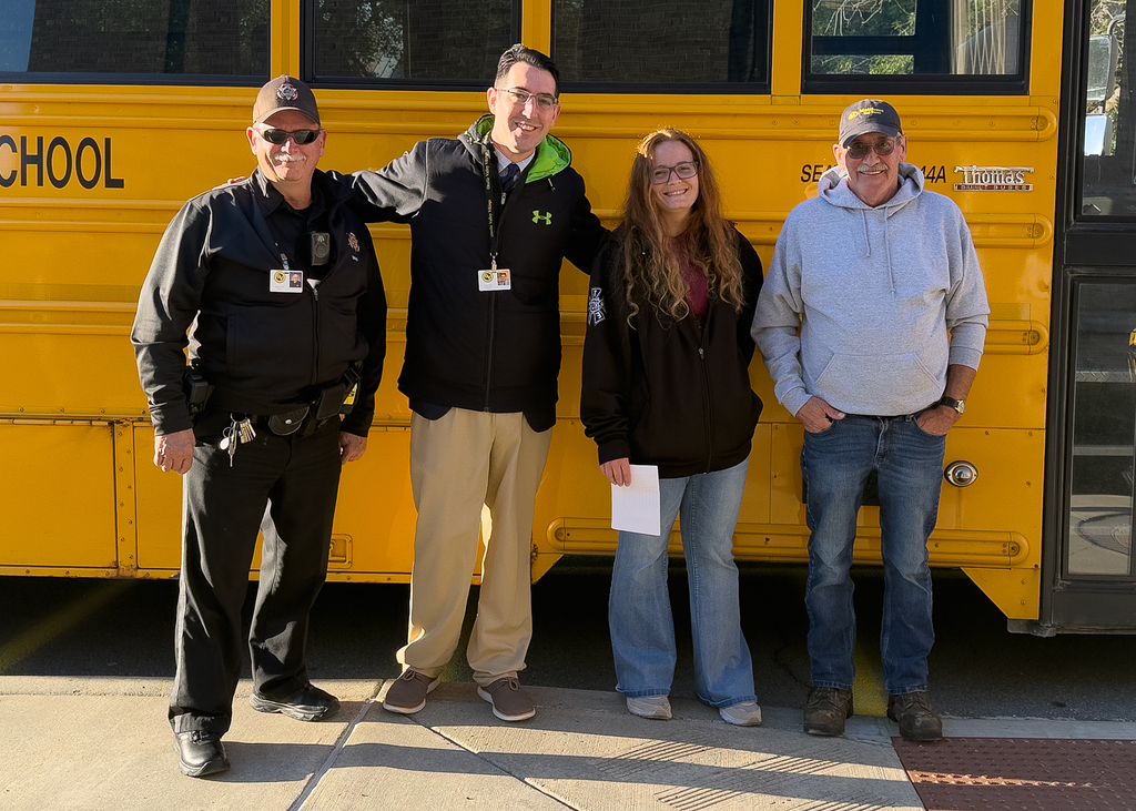 Staff in front of bus