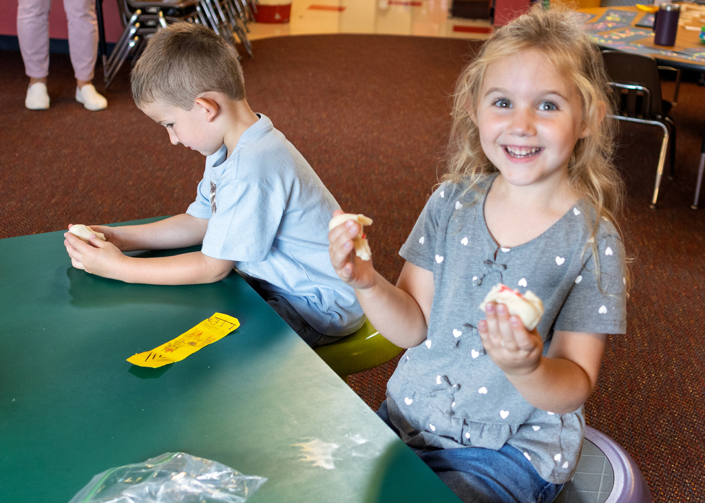 Happy student working with the playdough
