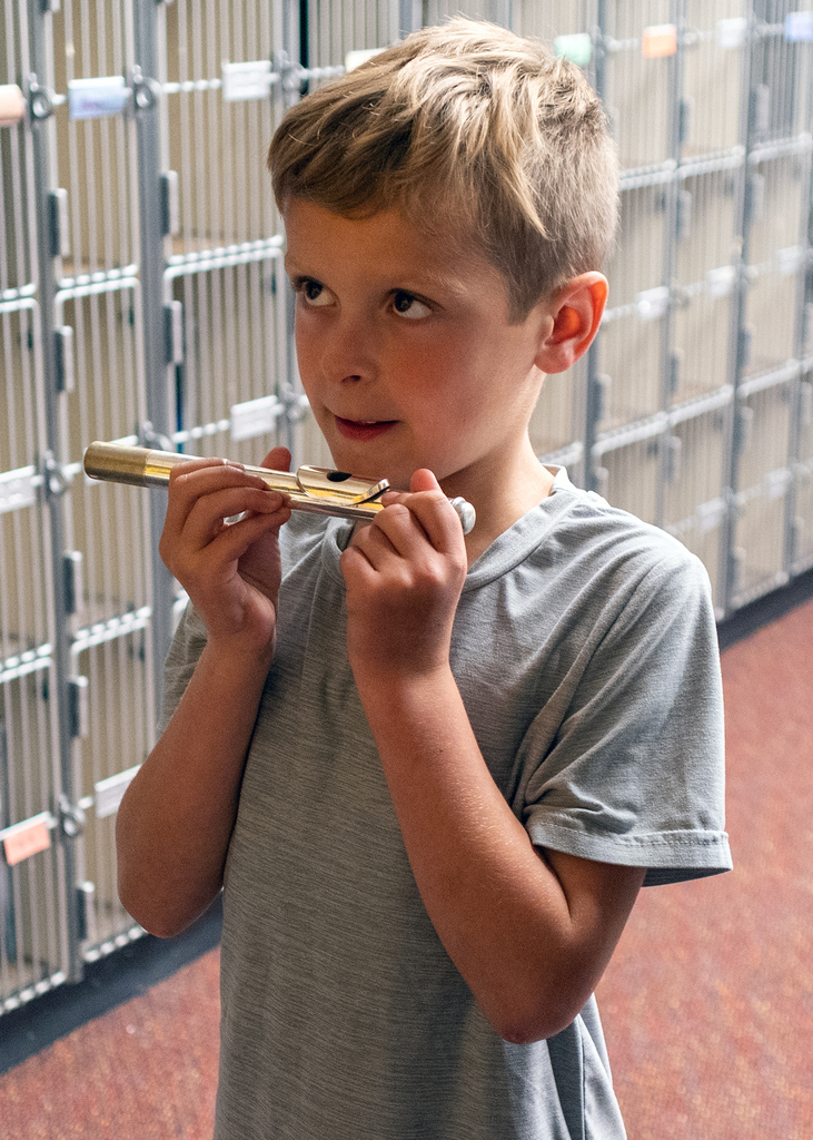 A student trying the flute