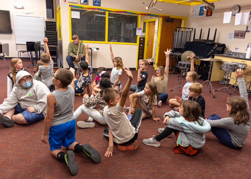 Student raising their hands