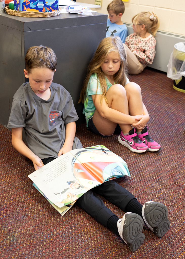 3rd and 4th graders practice reading
