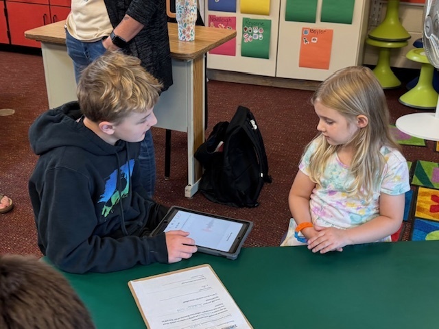 5th graders interview kindergarteners for new newsletter