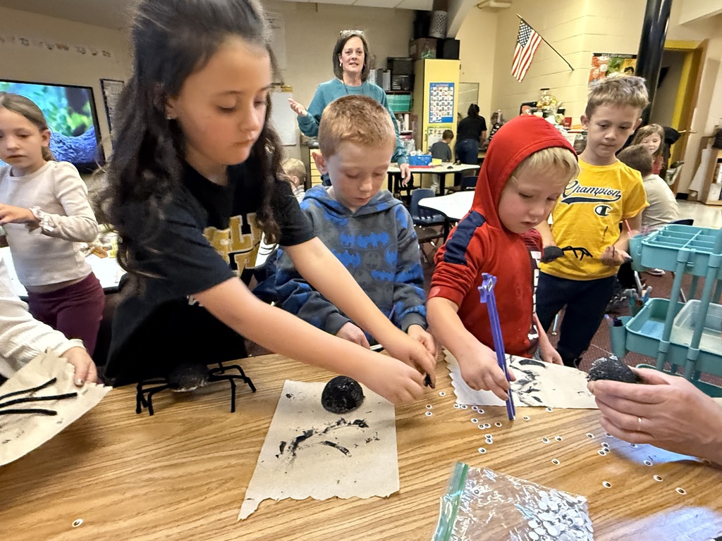 First graders building spiders during OT time and having a blast!
