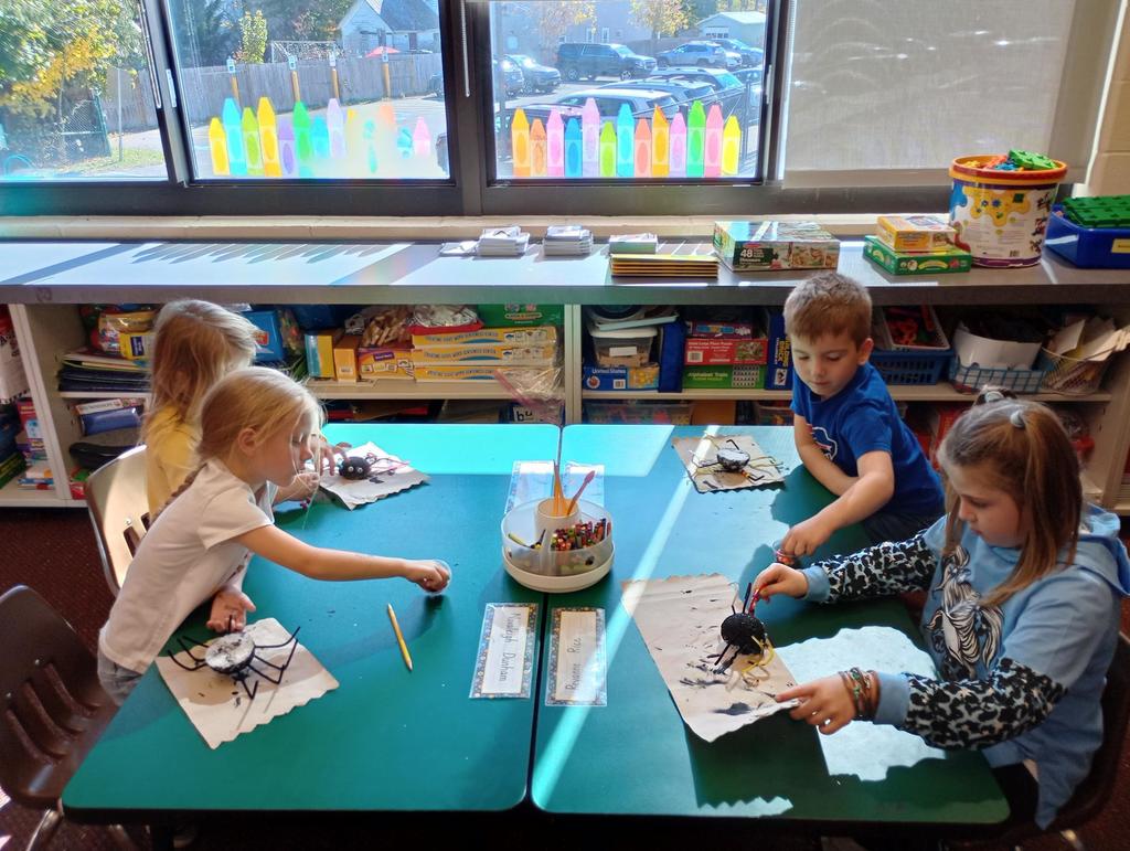 Kindergarteners making spiders!