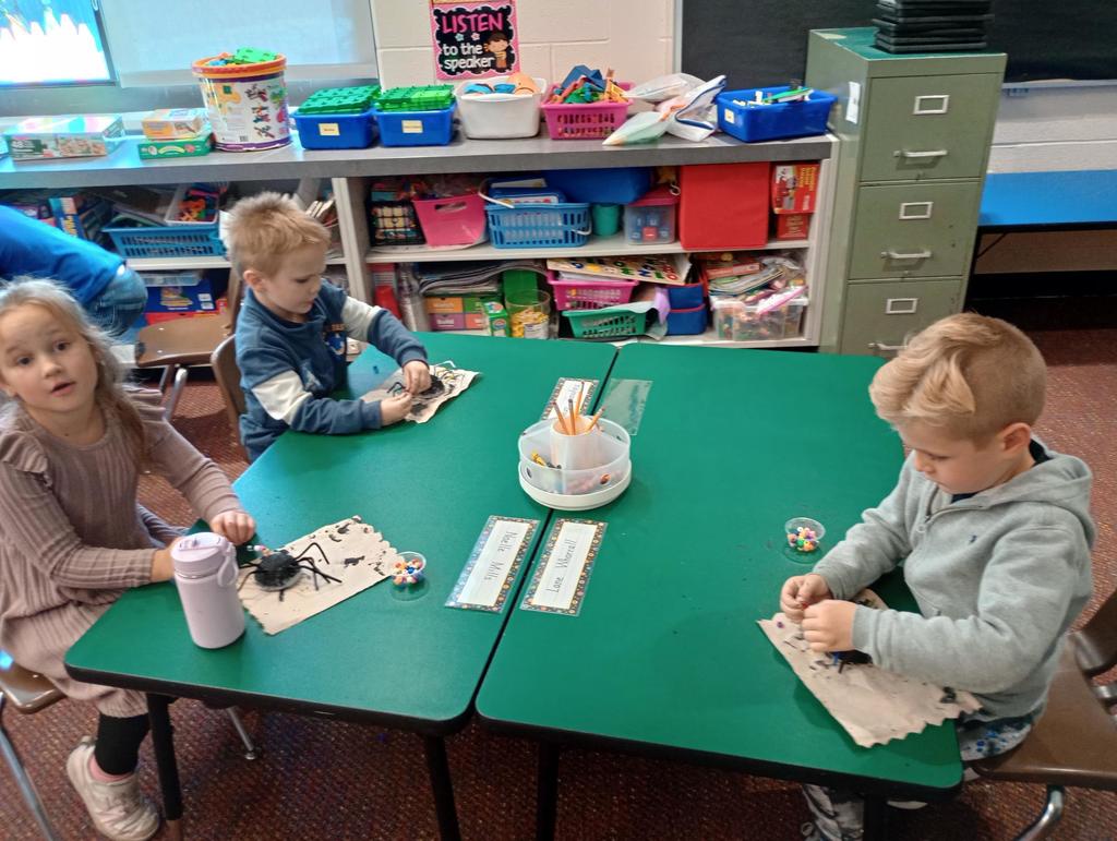 Kindergarteners making spiders!