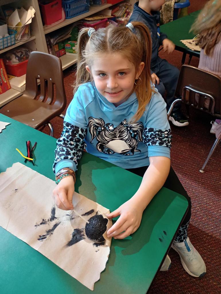 Kindergarteners making spiders!