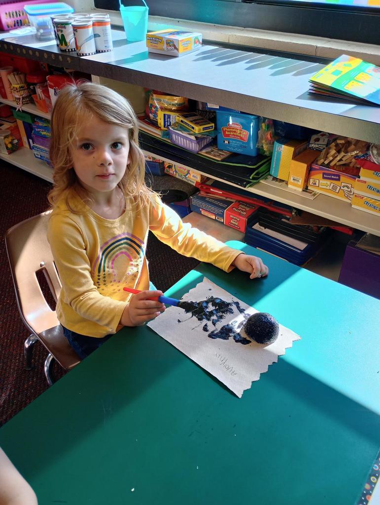 Kindergarteners making spiders!