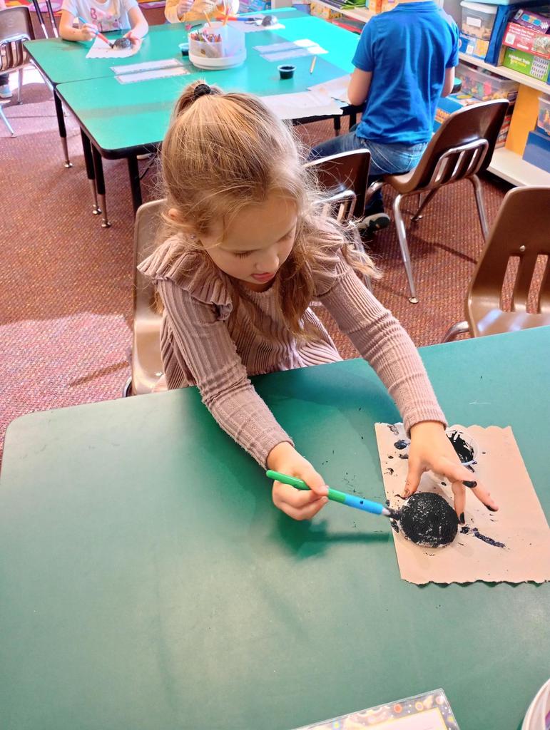 Kindergarteners making spiders!