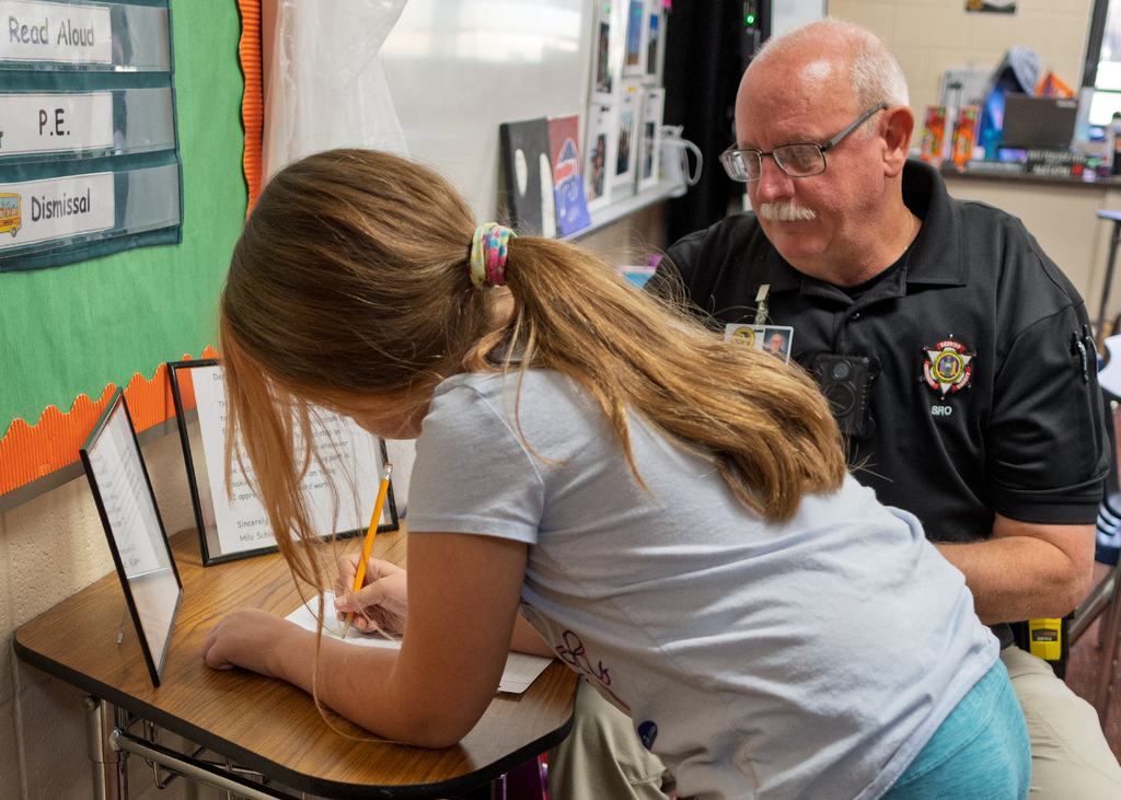 Student signing the voter log