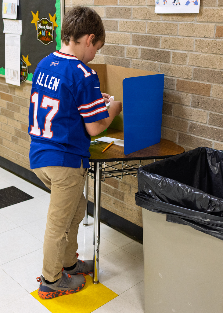 Student casting his vote