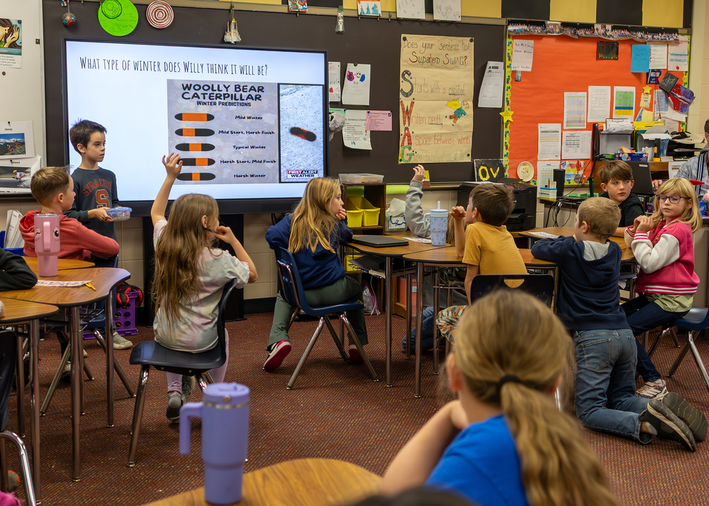 Hudson presents to the class about Willy the Wooly Bear Caterpillar