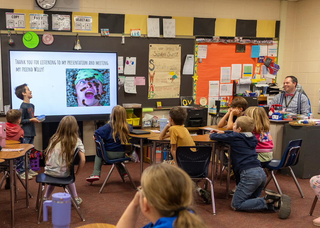 Hudson presents to the class about Willy the Wooly Bear Caterpillar