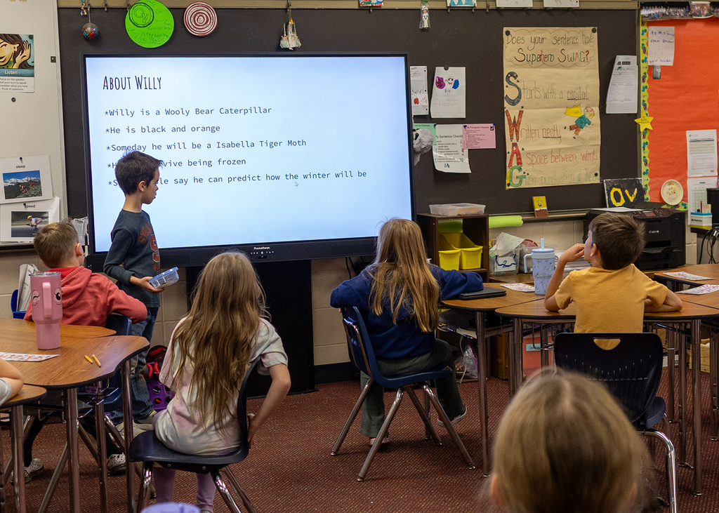 Hudson presents to the class about Willy the Wooly Bear Caterpillar