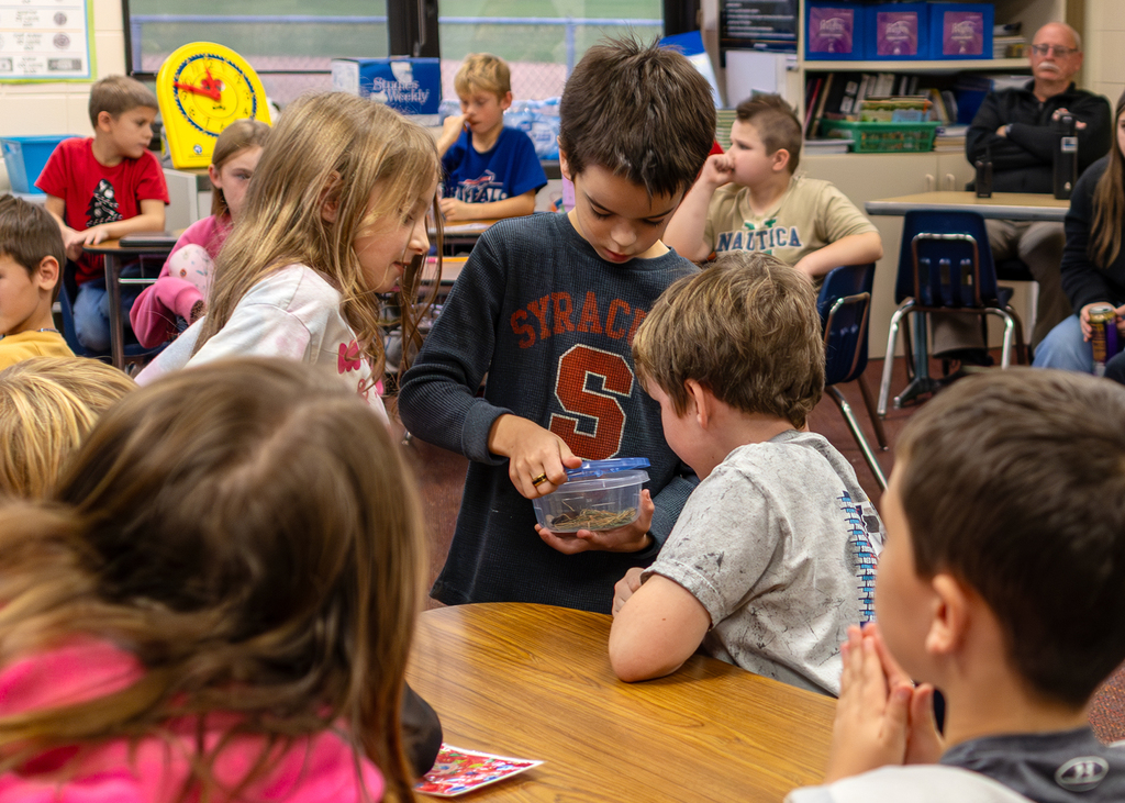 Hudson presents to the class about Willy the Wooly Bear Caterpillar