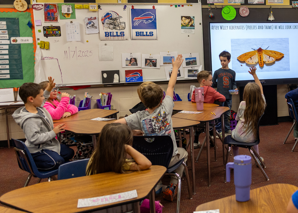 Hudson presents to the class about Willy the Wooly Bear Caterpillar