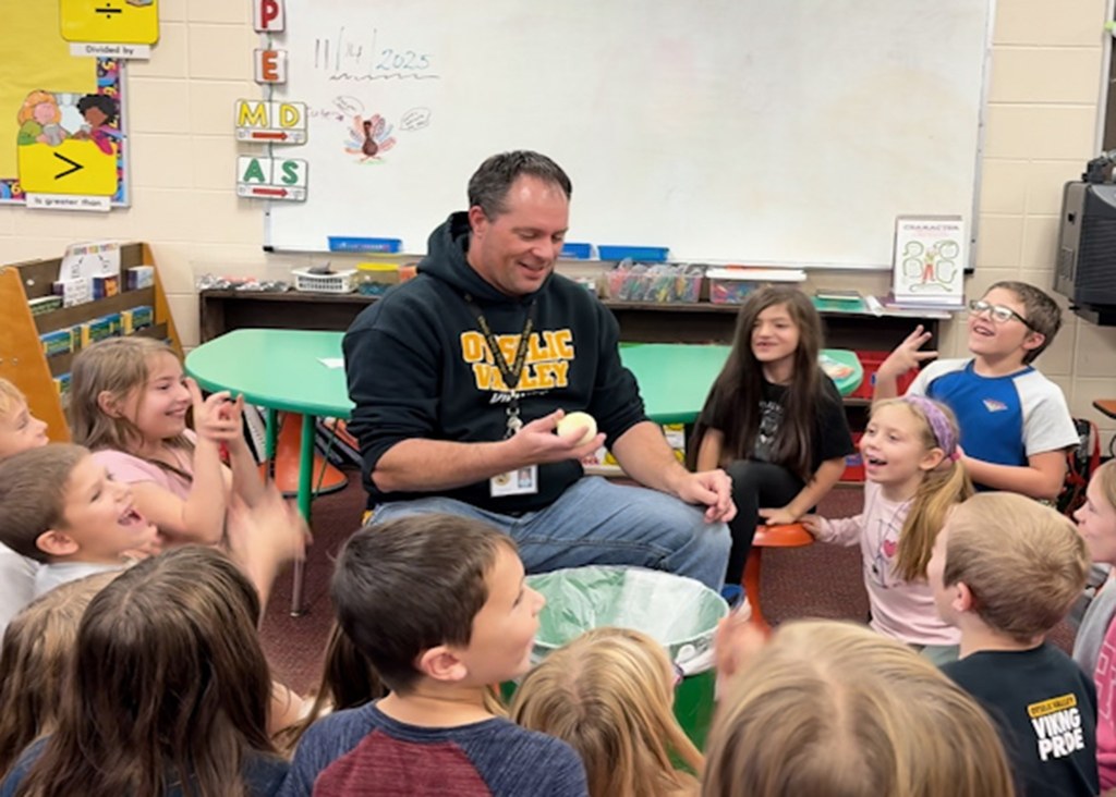 Mr. Gross gets ready to take a bite out of an onion