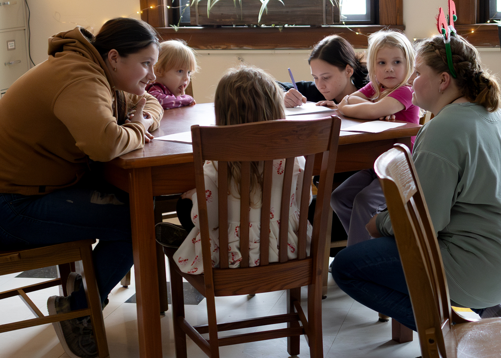 Seniors help PreK students write letters to Santa and color