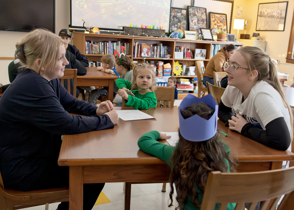 Seniors help PreK students write letters to Santa and color