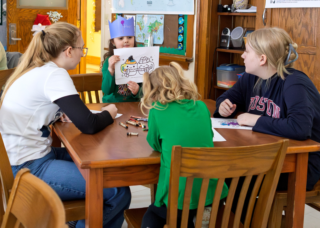 Seniors help PreK students write letters to Santa and color