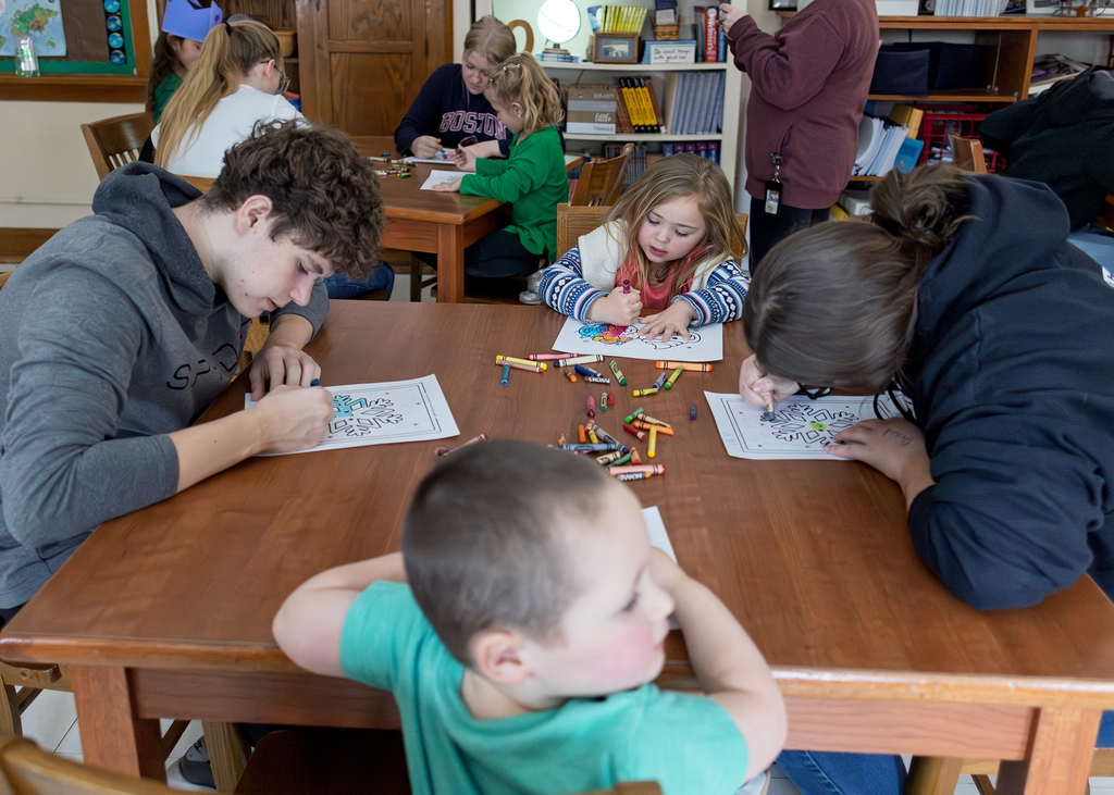 Seniors help PreK students write letters to Santa and color