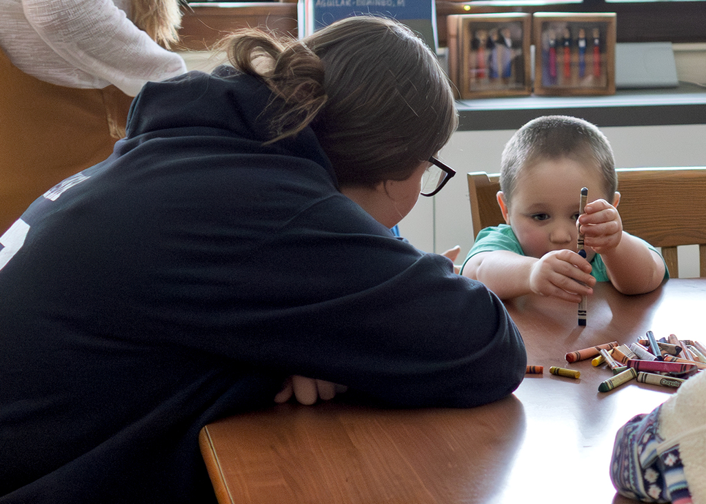 Seniors help PreK students write letters to Santa and color