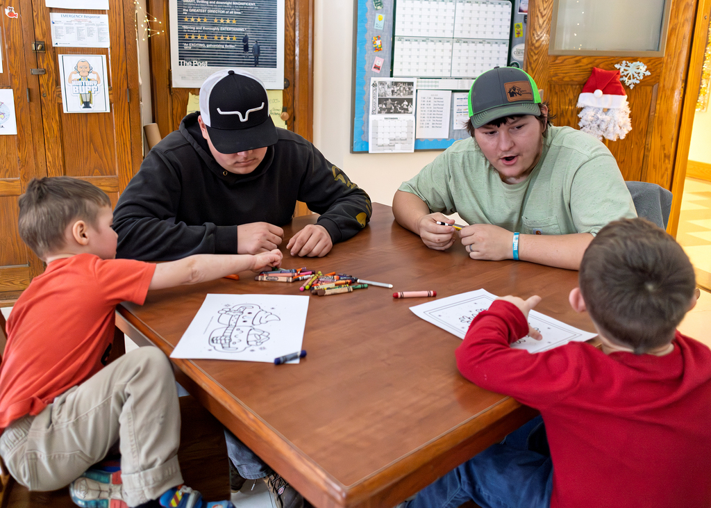 Seniors help PreK students write letters to Santa and color